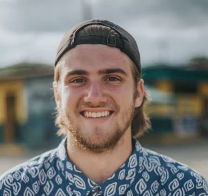 a smiling guy in a cap
